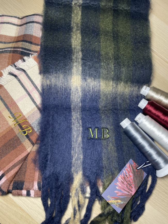 Embroidered initials on a scarf